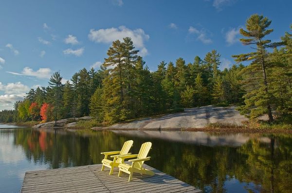 Canada-Ontario-Grundy Lake Provincial Park Muskoka chairs on lake dock